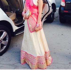 THREE PIECE LEHNGA. Gold sequins blouse. Coral dupatta and ivory lehnga